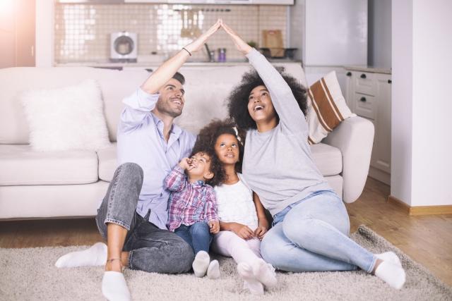 Family in front of couch